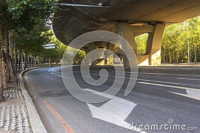 Asphalt roads and city buildings under the overpass, automobile advertising road material. Stock Photo